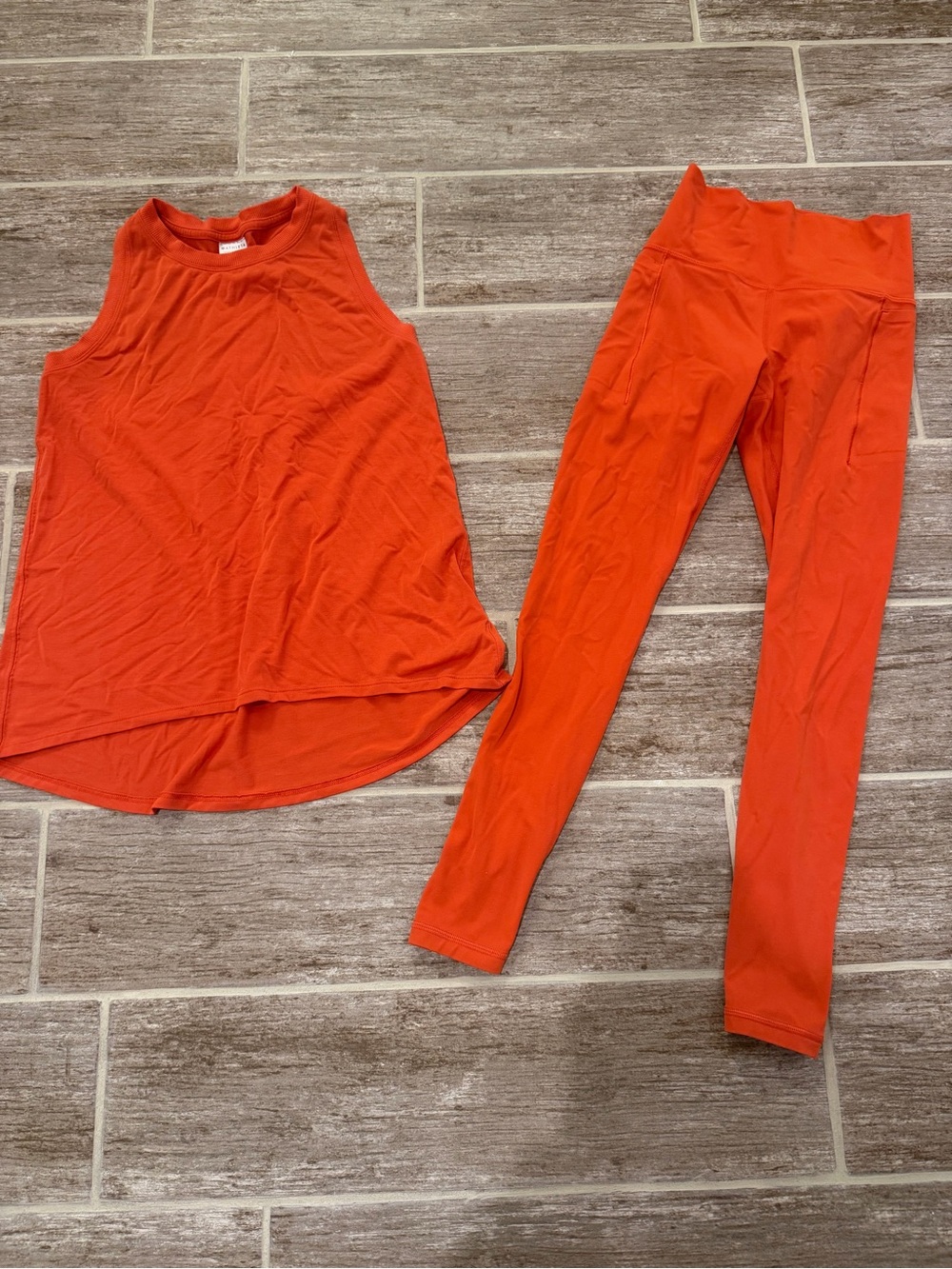 ATHLETA TRANSCEND HIGH RISE STASH TIGHT EASE IN TANK LARKSPUR RED ORANGE